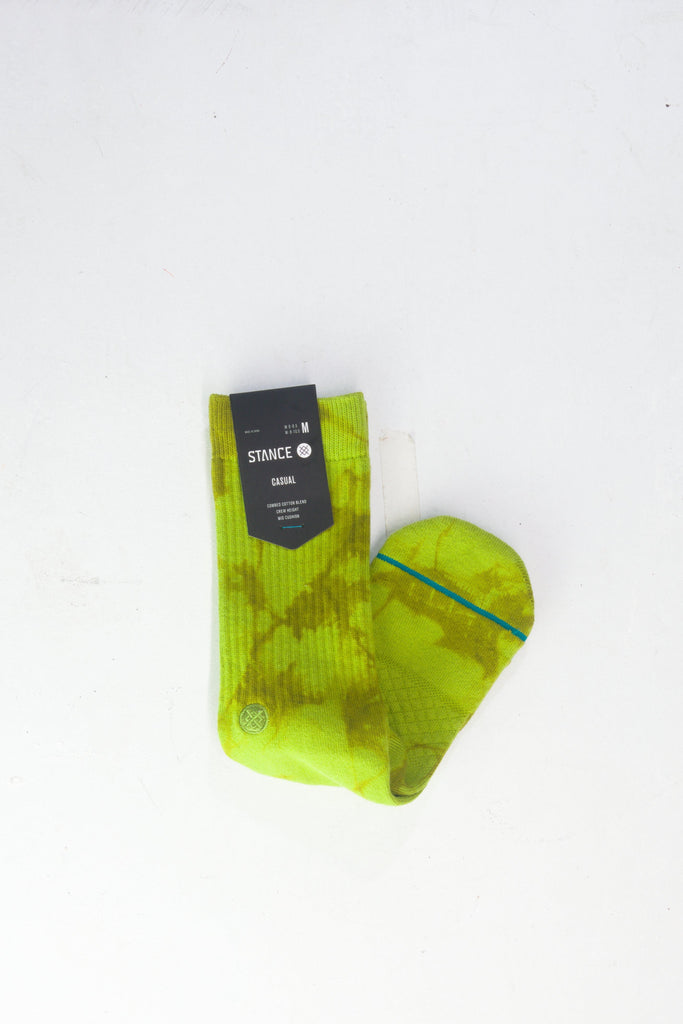 Neon yellow athletic sock with geometric pattern design.