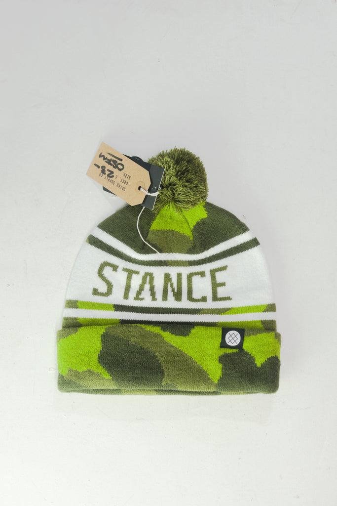 Green and white camouflage winter beanie with a pom-pom and ’STANCE’ text.