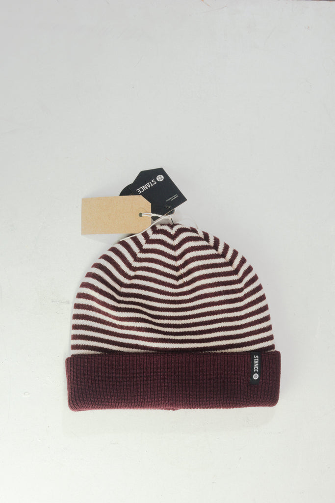 Burgundy and white striped knit beanie with a folded brim.