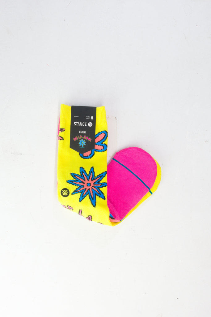 Pink and yellow beauty blender sponge with floral packaging.