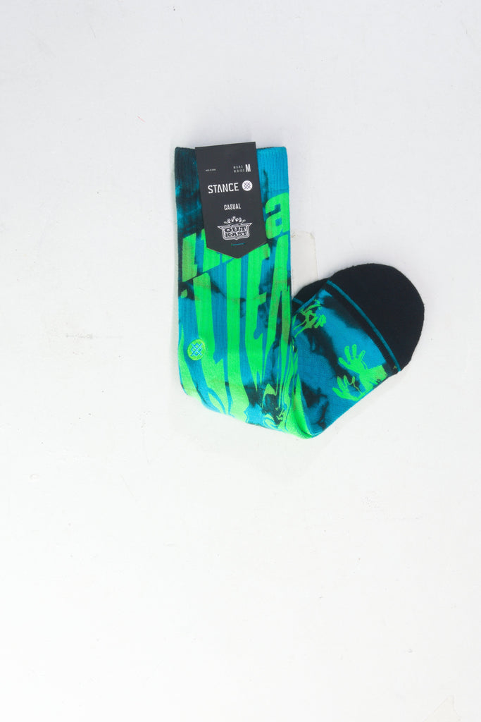 Colorful sock with blue and green cactus pattern.