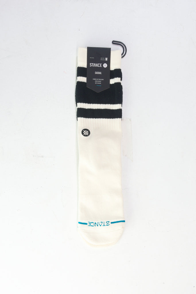 White athletic sock with black stripes and blue accents.