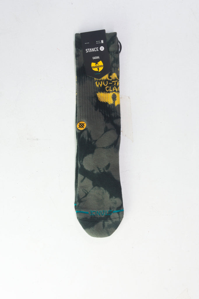 Dark gray sock with yellow sunflower designs and a camouflage-style pattern.