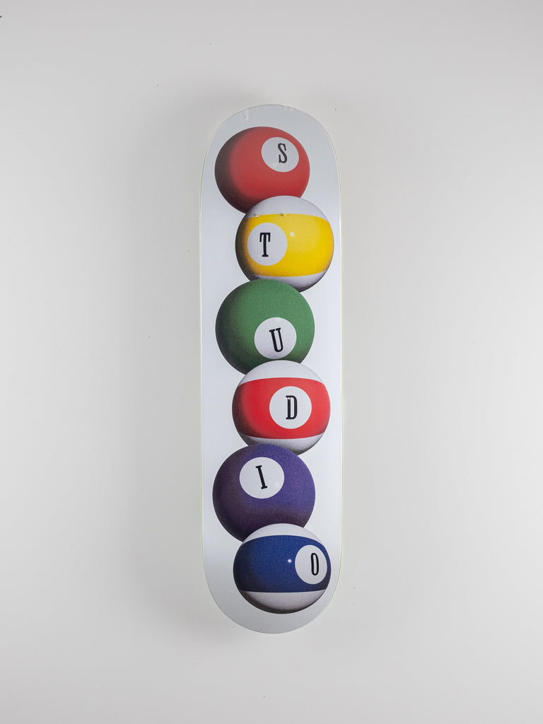 Colorful billiard ball design spelling studio on a 8.50 inch air brush skateboard deck