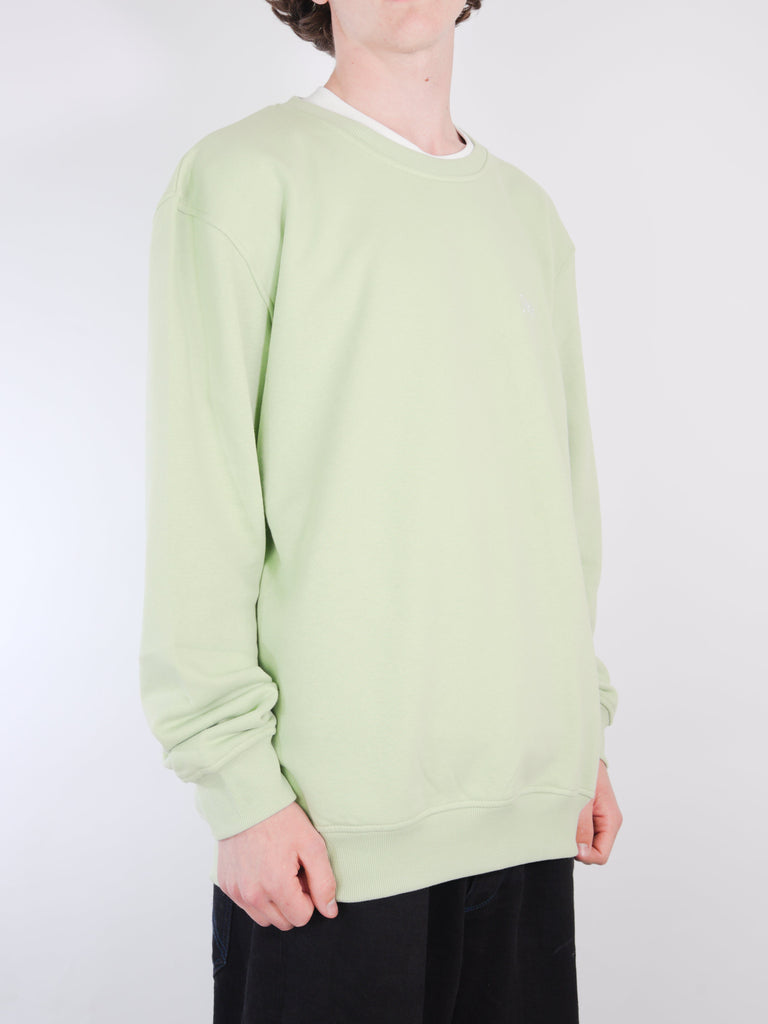 Pale green crewneck sweater with long sleeves.