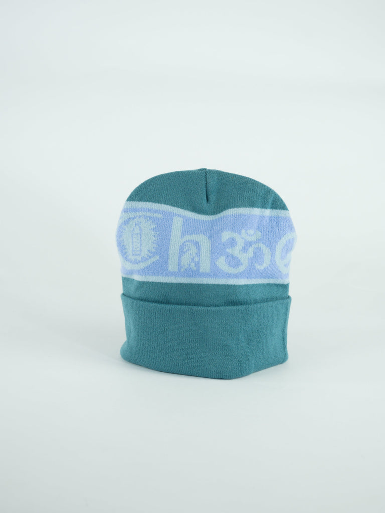 Teal winter beanie with a light blue band featuring text.