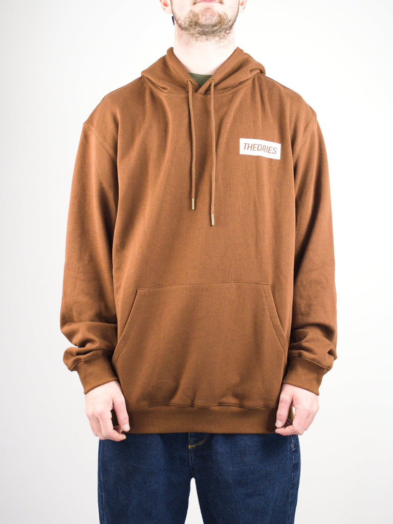 Brown hooded sweatshirt with a white rectangular logo patch.