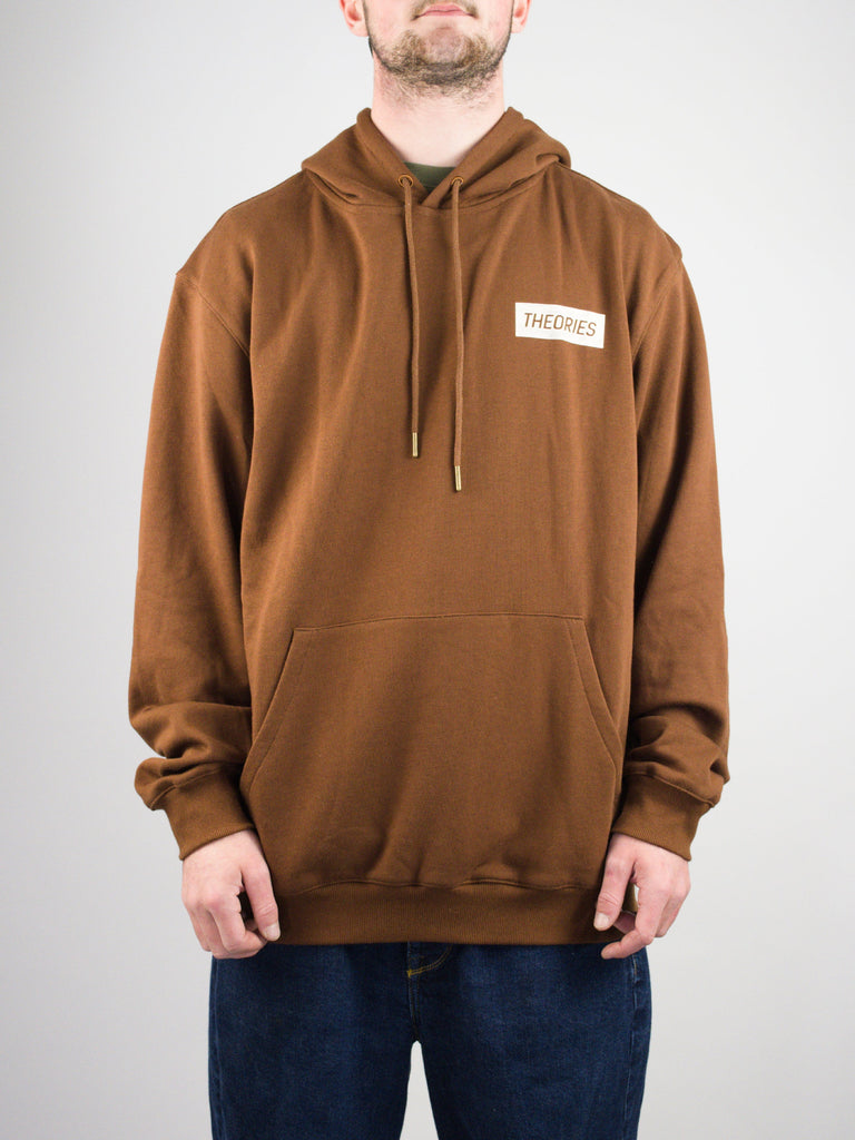 Brown hooded sweatshirt with a white rectangular logo patch.