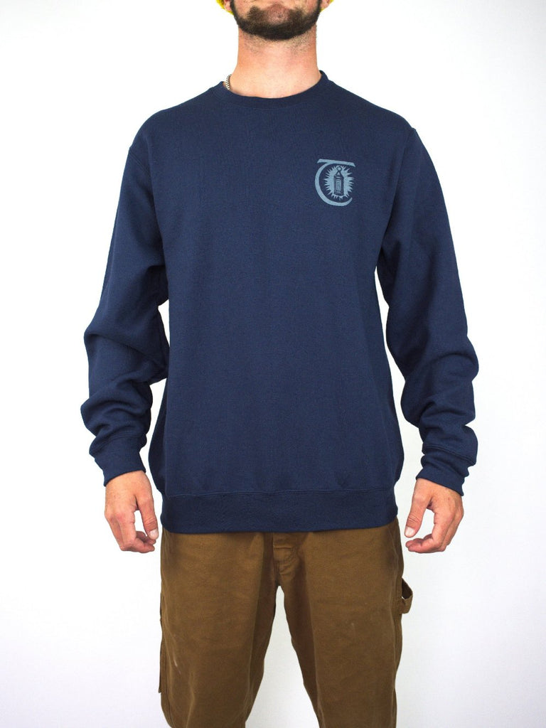 Navy blue sweatshirt with a small logo on the chest.