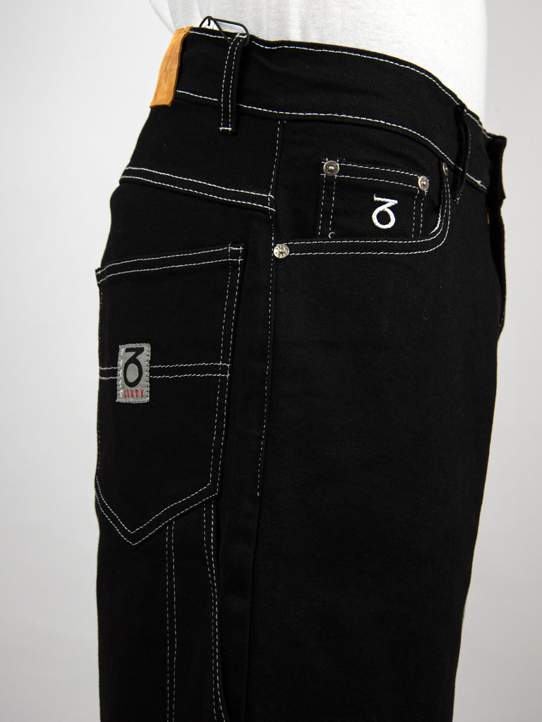 Black denim jeans with contrasting white stitching and multiple pockets.