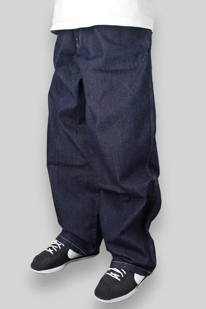 Navy blue baggy pants with black and white sneakers.