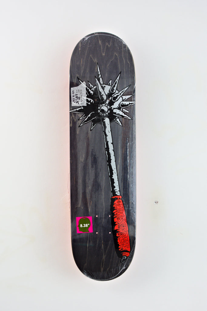 Black skateboard deck featuring artwork of a palm tree with red and white details.