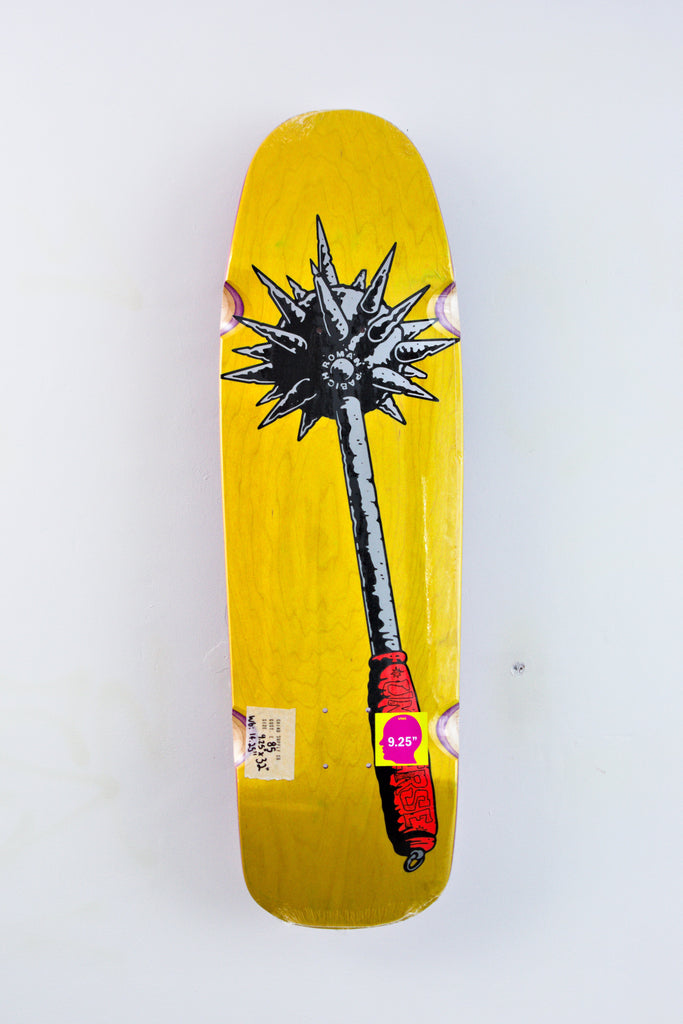 Yellow skateboard deck featuring black and red artwork of a spiked mace weapon.