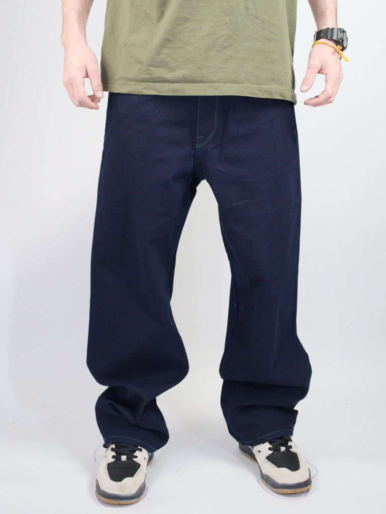 Navy blue baggy sweatpants with elastic cuffs at the ankles.