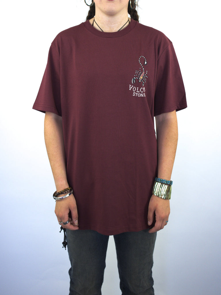 Burgundy t-shirt with a small graphic design on the chest.