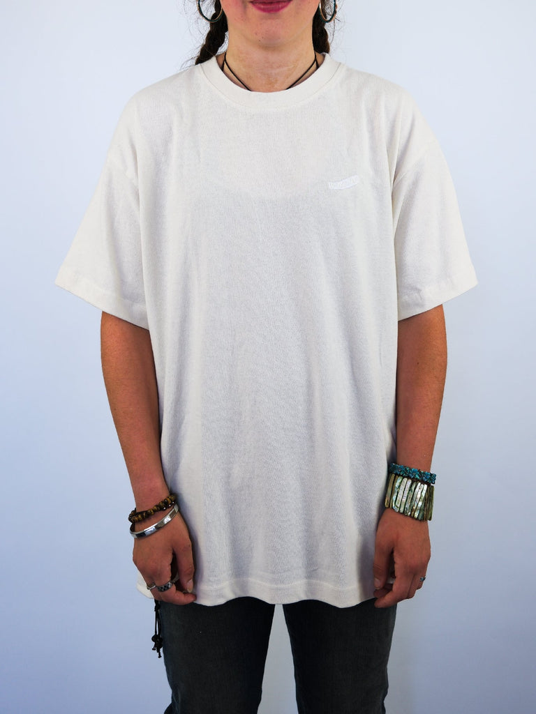 Plain white crew neck t-shirt.