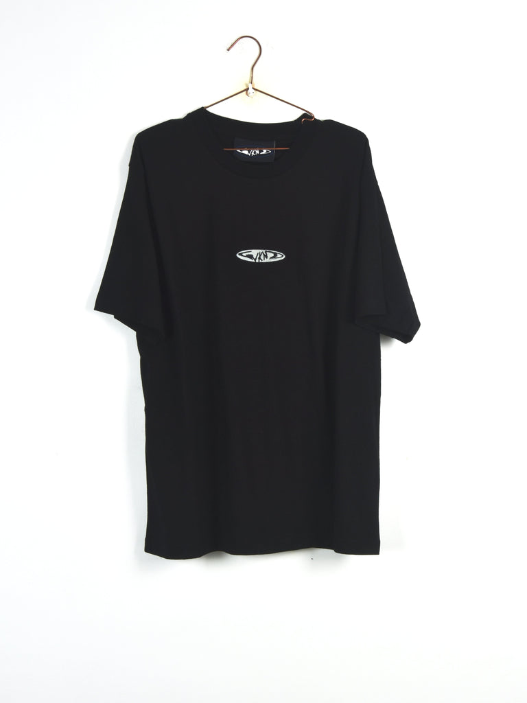 Black t-shirt with a small logo hanging on a metal hanger.