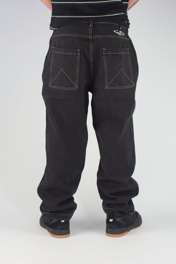 Black baggy heavyweight Gene’s jeans with triangle-shaped back pockets and visible stitching