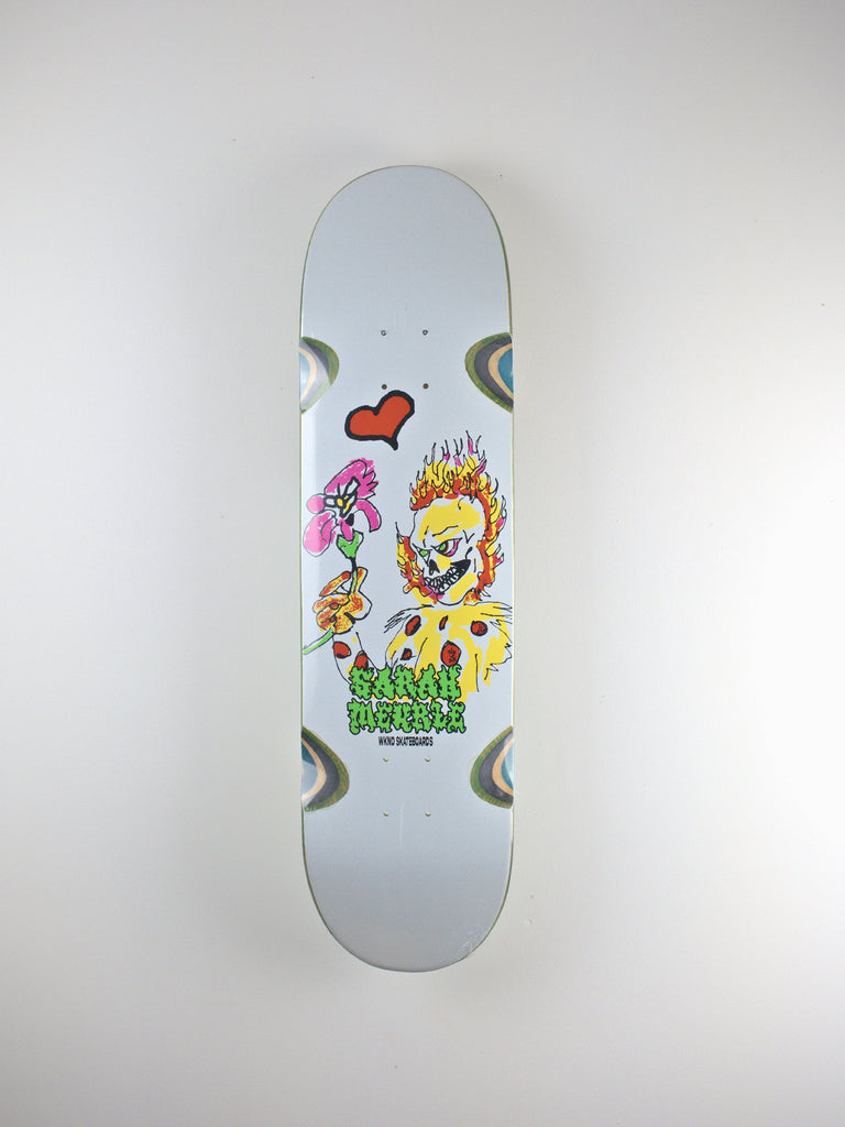 Skateboard deck featuring a colorful cartoon clown character design.