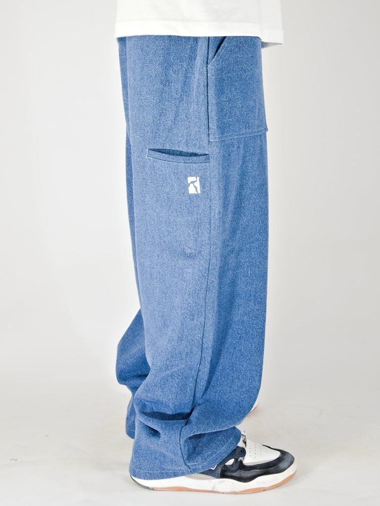 Baggy blue denim jeans with a visible pocket.